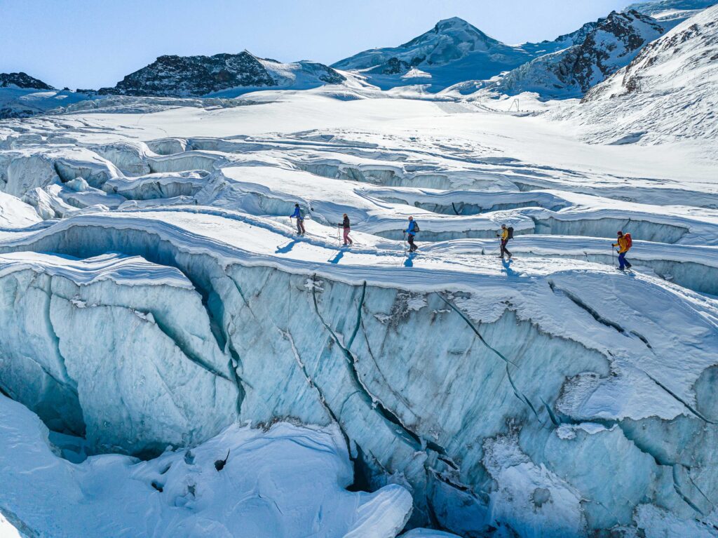 people walking on glacier