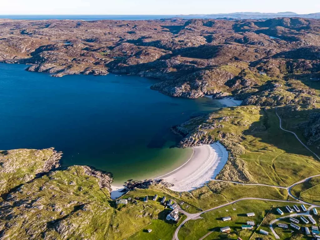 aerial shot of stunning Scottish scenery of a white sand beach