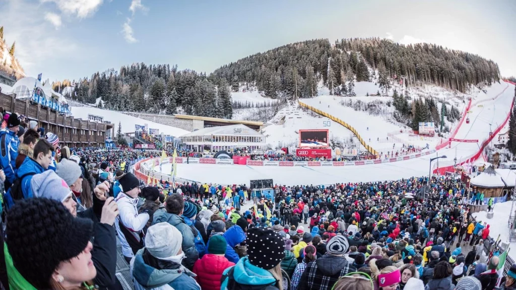 a huge crowd at the foot of a World Cup ski run in Val Gardena