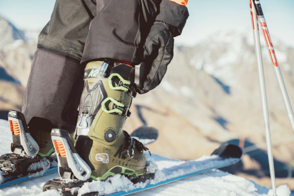 Close-up of a ski boot with the Carv 2 device clipped securely to the strap